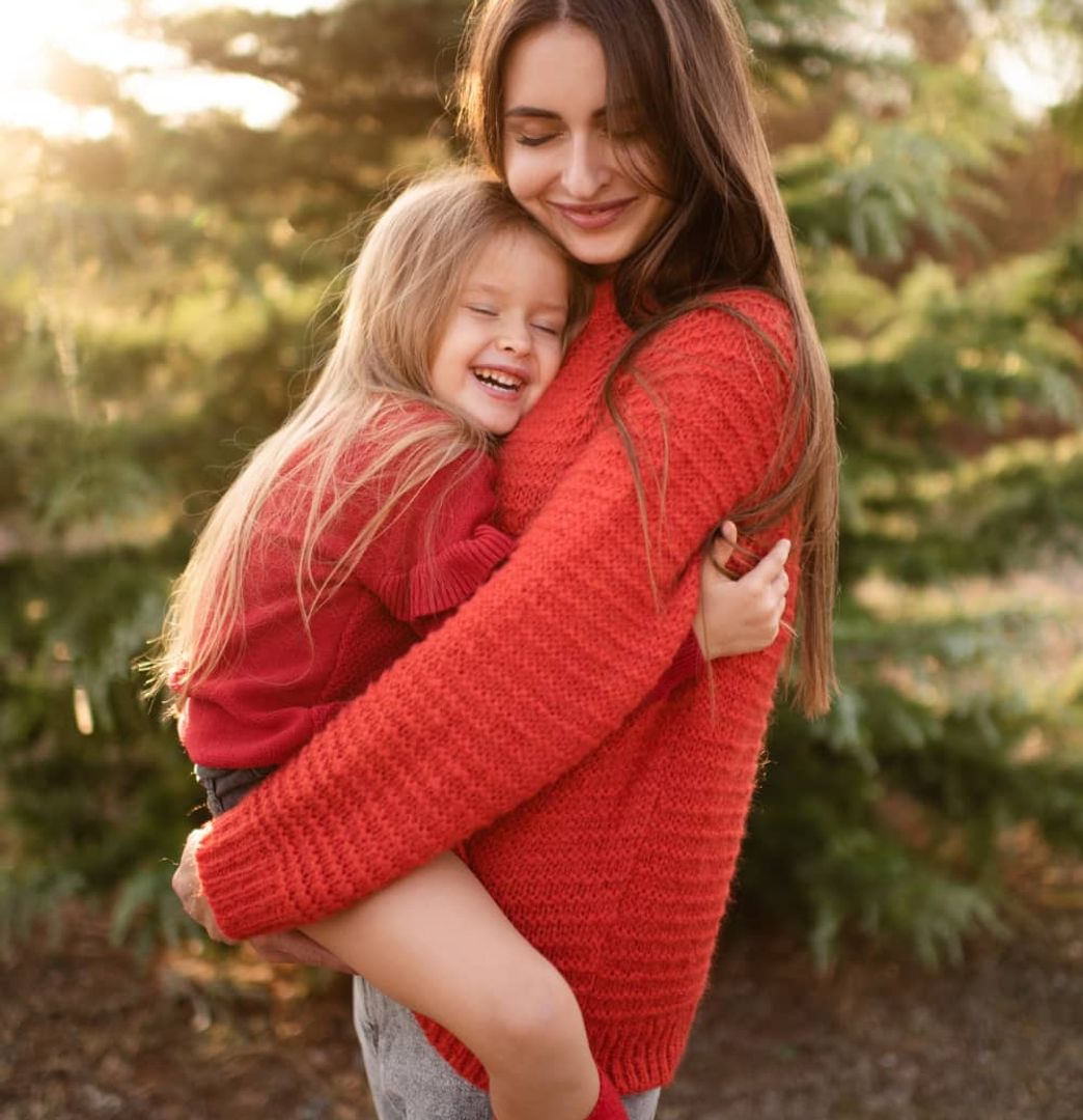 Woman in red blazer smiling